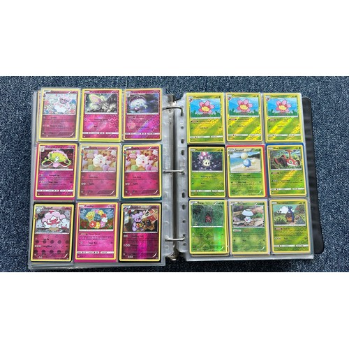 403 - A folder containing duplicates of Pokemon cards. Various sets and series including Base Set, Ultra P... 