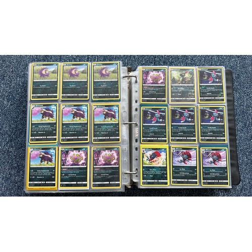 403 - A folder containing duplicates of Pokemon cards. Various sets and series including Base Set, Ultra P... 