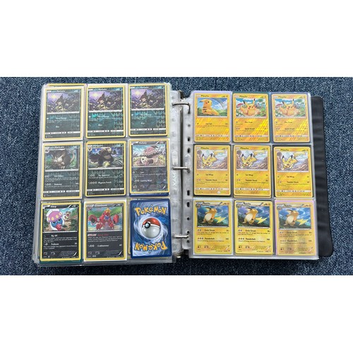 403 - A folder containing duplicates of Pokemon cards. Various sets and series including Base Set, Ultra P... 