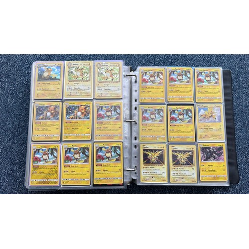 403 - A folder containing duplicates of Pokemon cards. Various sets and series including Base Set, Ultra P... 