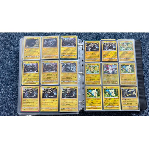 403 - A folder containing duplicates of Pokemon cards. Various sets and series including Base Set, Ultra P... 