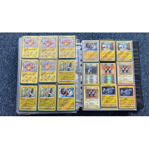 403 - A folder containing duplicates of Pokemon cards. Various sets and series including Base Set, Ultra P... 