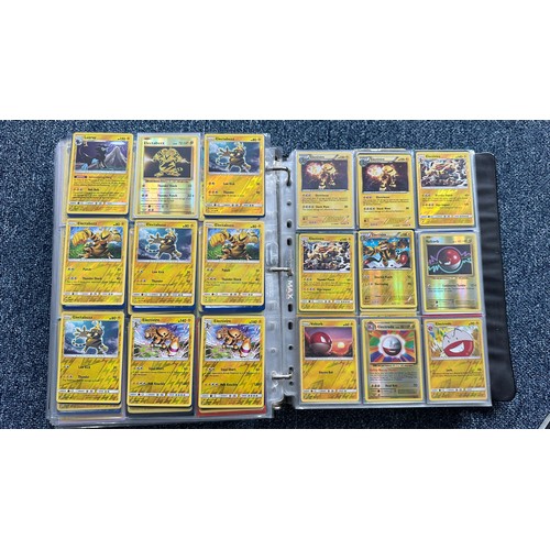 403 - A folder containing duplicates of Pokemon cards. Various sets and series including Base Set, Ultra P... 