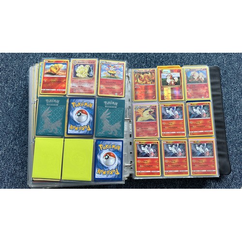 403 - A folder containing duplicates of Pokemon cards. Various sets and series including Base Set, Ultra P... 