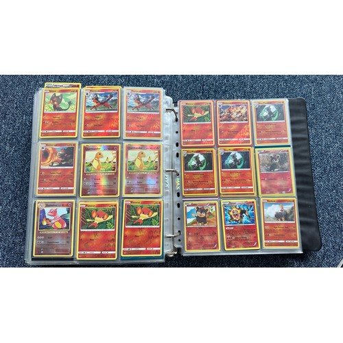 403 - A folder containing duplicates of Pokemon cards. Various sets and series including Base Set, Ultra P... 