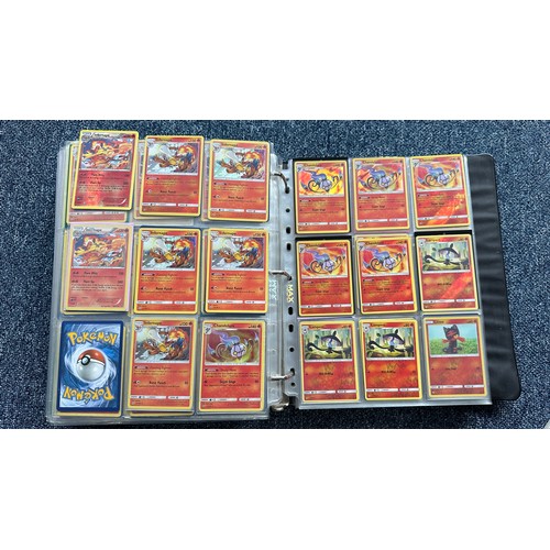 403 - A folder containing duplicates of Pokemon cards. Various sets and series including Base Set, Ultra P... 