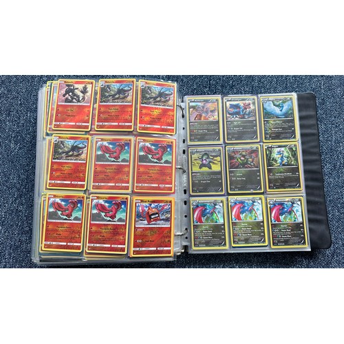 403 - A folder containing duplicates of Pokemon cards. Various sets and series including Base Set, Ultra P... 