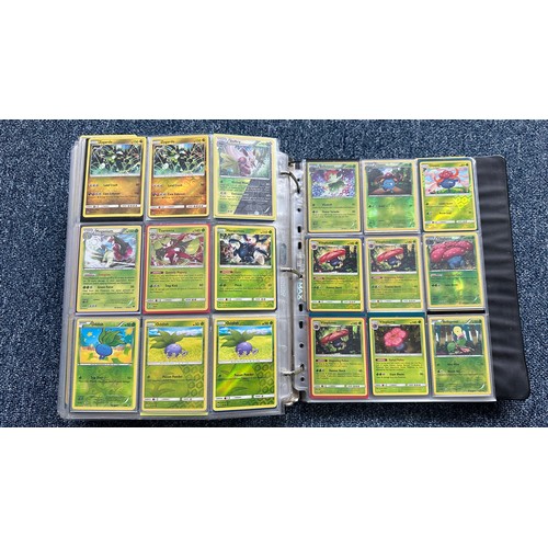 403 - A folder containing duplicates of Pokemon cards. Various sets and series including Base Set, Ultra P... 