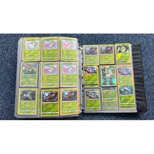 403 - A folder containing duplicates of Pokemon cards. Various sets and series including Base Set, Ultra P... 