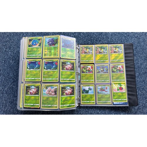 403 - A folder containing duplicates of Pokemon cards. Various sets and series including Base Set, Ultra P... 