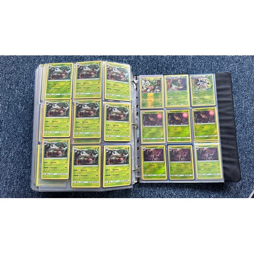 403 - A folder containing duplicates of Pokemon cards. Various sets and series including Base Set, Ultra P... 