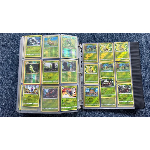 403 - A folder containing duplicates of Pokemon cards. Various sets and series including Base Set, Ultra P... 