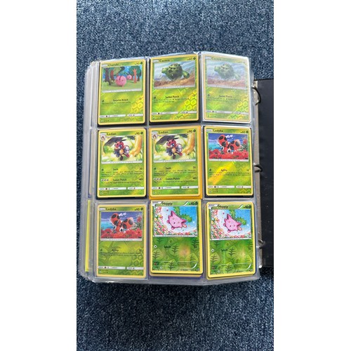 403 - A folder containing duplicates of Pokemon cards. Various sets and series including Base Set, Ultra P... 