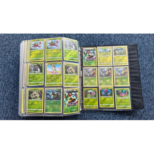 403 - A folder containing duplicates of Pokemon cards. Various sets and series including Base Set, Ultra P... 