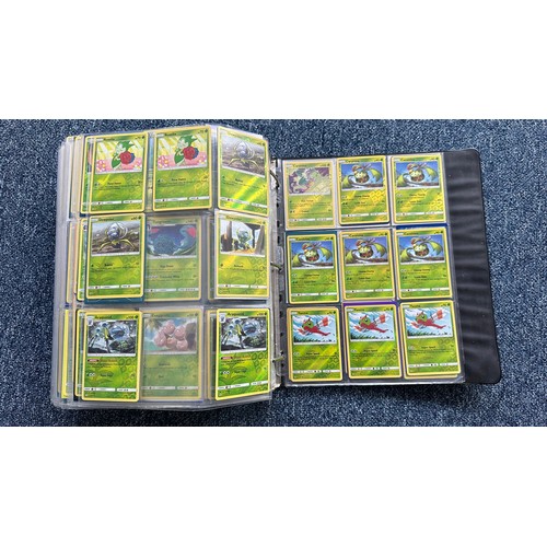 403 - A folder containing duplicates of Pokemon cards. Various sets and series including Base Set, Ultra P... 