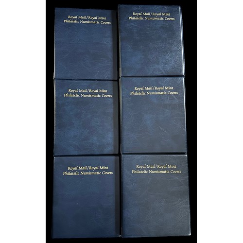 95 - Accessories, six Royal Mail / Royal Mint Blue Coin Cover Albums, all with their slipcases, plus clea... 