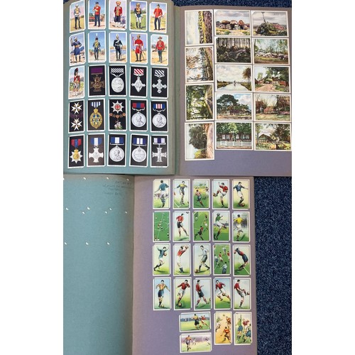 307 - Cigarette Cards. Mixed lot of mainly foreign cards in six scrap albums, Chinese, Far East Siamese 14... 