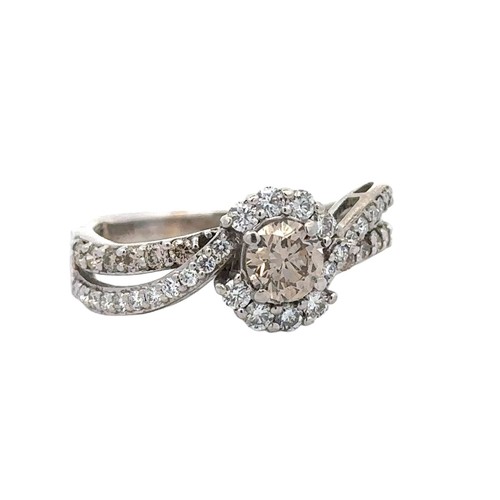 51 - A 14ct white gold and diamond ring with twisted split shank set with diamonds. Central diamond appro... 