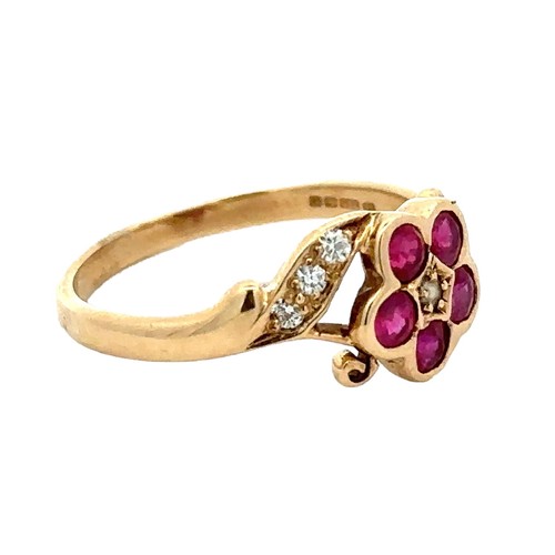 55 - A 9ct ruby and seed pearl flower ring with diamond set shoulders. Size P. Weight 2.43g. Birmingham h... 