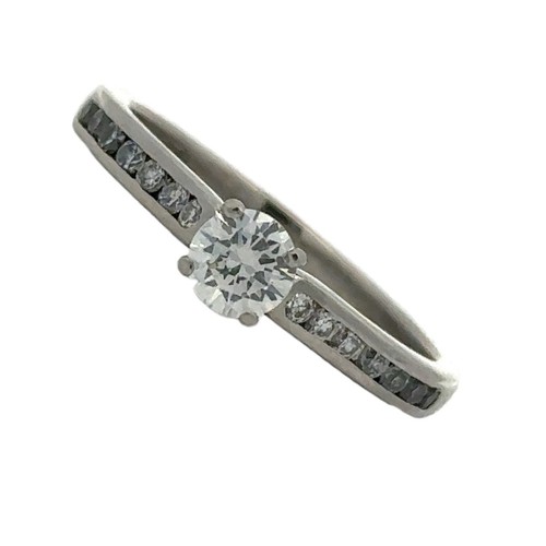 73 - A platinum and diamond ring set with a central diamond of 0.3ct approx colour E, VS2 clarity. Should... 