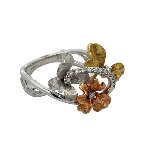 74 - An unusual and striking tri-colour 18ct gold and diamond flowers ring. Split twisted shank with leaf... 