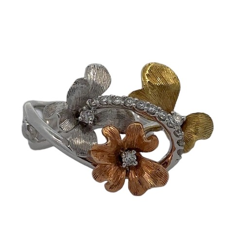 74 - An unusual and striking tri-colour 18ct gold and diamond flowers ring. Split twisted shank with leaf... 