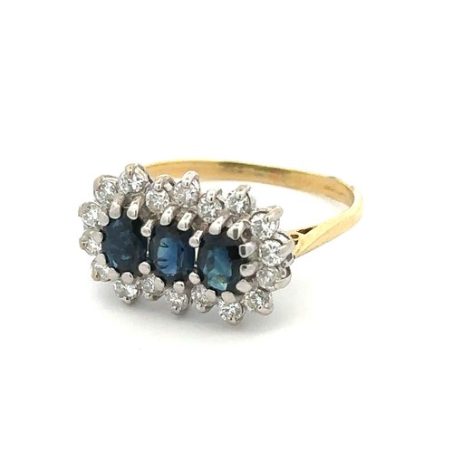 62 - A sapphire and diamond triple cluster ring. 18ct yellow gold shank with 18ct white gold gallery rail... 