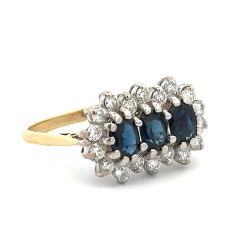 62 - A sapphire and diamond triple cluster ring. 18ct yellow gold shank with 18ct white gold gallery rail... 