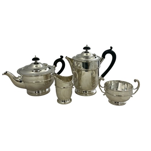 164 - A George V four piece silver tea service of circular form with ribbed girdle by Maxfield & Sons Ltd ... 