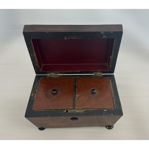 252 - A vintage wooden tea caddy with two internal compartments. Dimensions approx 20.5 x 12 x 12cm.