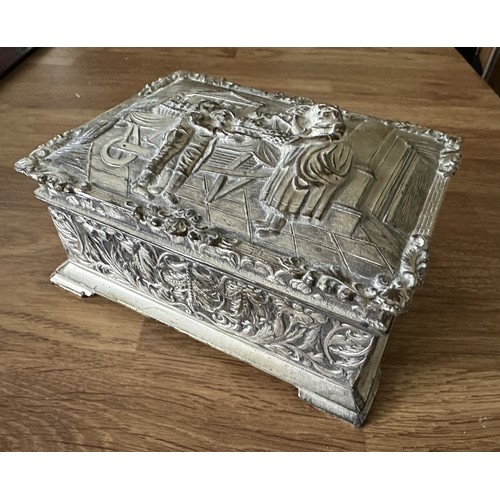 255 - Four white metal trinket boxes with embossed decoration. Some of the hinges are in need repair - ple... 