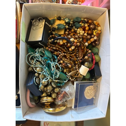 46 - A large amount of costume jewellery, a jewellery stand and wire dress display stand.
Please see the ... 