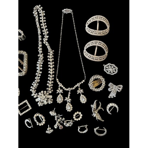 65 - A number of white metal and silver paste and marcasite jewellery items. Also some vintage paste buck... 