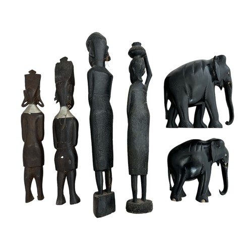 345 - African, group of carved African objects to include; three hardwood figurines plus other and two ebo... 