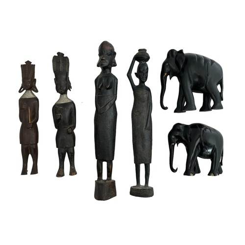 345 - African, group of carved African objects to include; three hardwood figurines plus other and two ebo... 