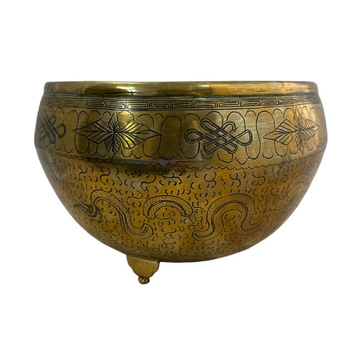 362 - Chinese brass jardiniere on three feet, with engraved dragon decoration to exterior surround. Diamet... 