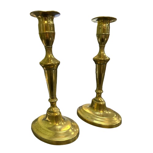 259 - Pair of Brass candlesticks marked ‘G.MD’ to underside of base. Height 23cm. (2)