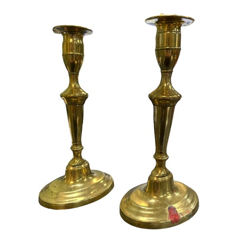 259 - Pair of Brass candlesticks marked ‘G.MD’ to underside of base. Height 23cm. (2)