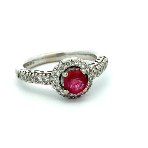 78 - A 14ct white gold treated ruby and diamond cluster ring, size M/N.  Ruby is a good colour, approx 0.... 