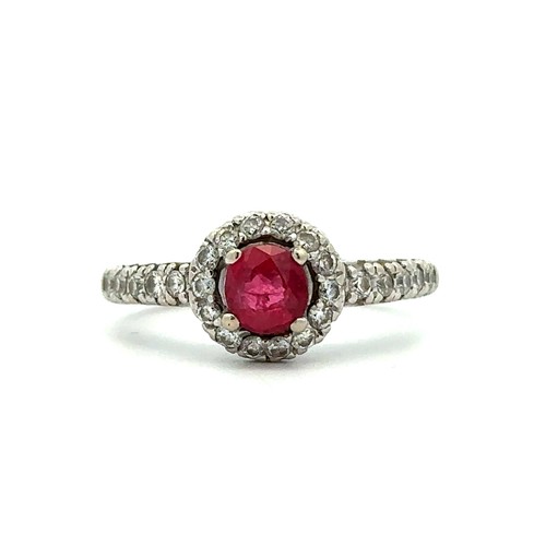 78 - A 14ct white gold treated ruby and diamond cluster ring, size M/N.  Ruby is a good colour, approx 0.... 