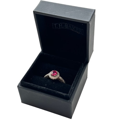 78 - A 14ct white gold treated ruby and diamond cluster ring, size M/N.  Ruby is a good colour, approx 0.... 