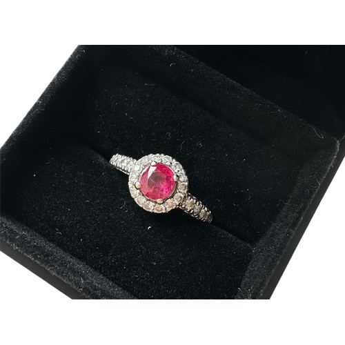 78 - A 14ct white gold treated ruby and diamond cluster ring, size M/N.  Ruby is a good colour, approx 0.... 