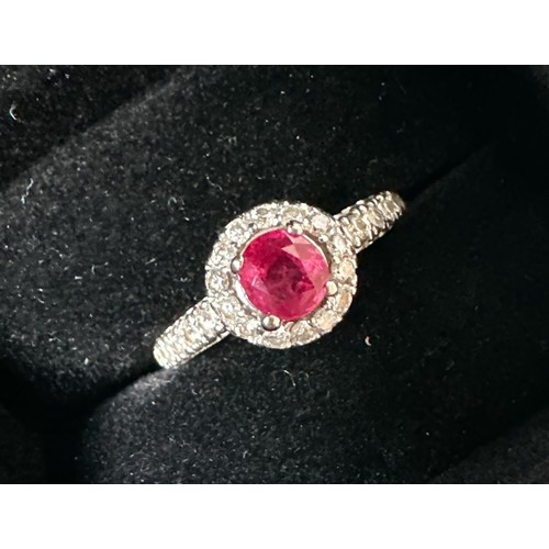 78 - A 14ct white gold treated ruby and diamond cluster ring, size M/N.  Ruby is a good colour, approx 0.... 