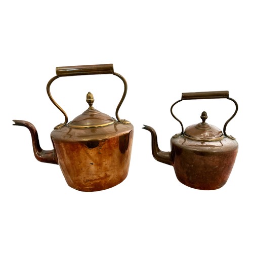 258 - Pair of Copper Kettles, two sized. Largest height 32cm, width 23cm. Smallest height 23cm, width 17cm... 