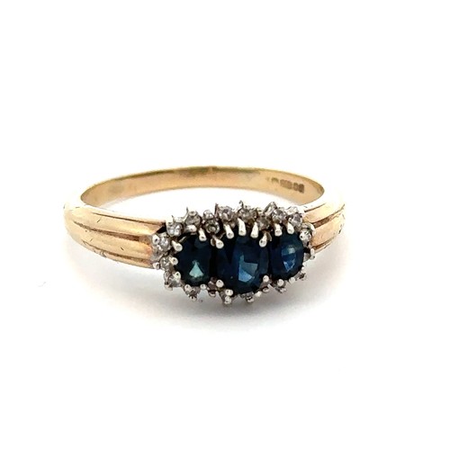 3 - A three stone sapphire and diamond cluster ring, set in 9ct yellow gold. London hallmarks. Size S/T.... 