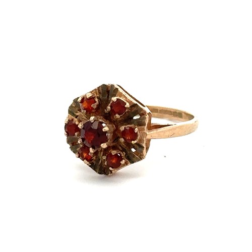 68 - A 9ct gold and garnet cluster ring with Birmingham hallmarks. Size J. Weight 2.03g.
Please see the b... 