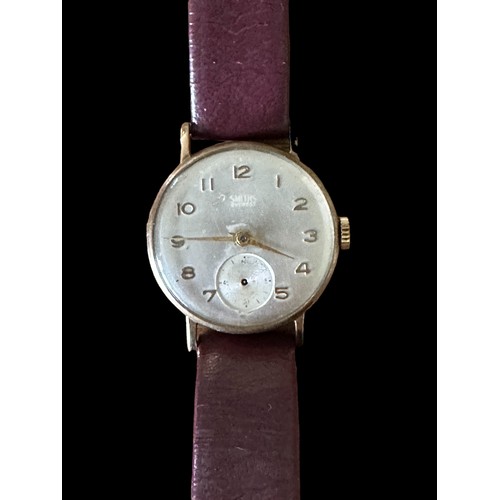 147 - A Smiths Everest 9ct gold watch with silvered dial, Arabic numerals and subsidiary seconds dial. On ... 