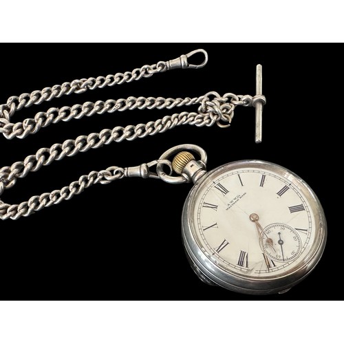 157 - A Victorian Waltham silver pocket watch with Albert chain. Pocket watch with white enamel dial (with... 