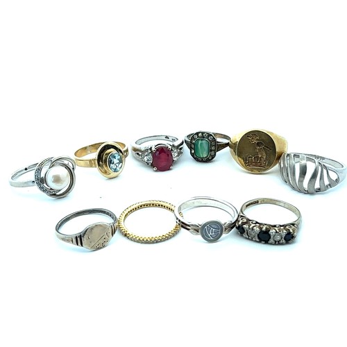 79 - Ten hallmarked silver or stamped 925 rings, including a ruby set ring and a topaz set ring.