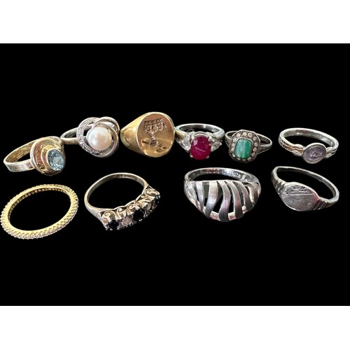 79 - Ten hallmarked silver or stamped 925 rings, including a ruby set ring and a topaz set ring.